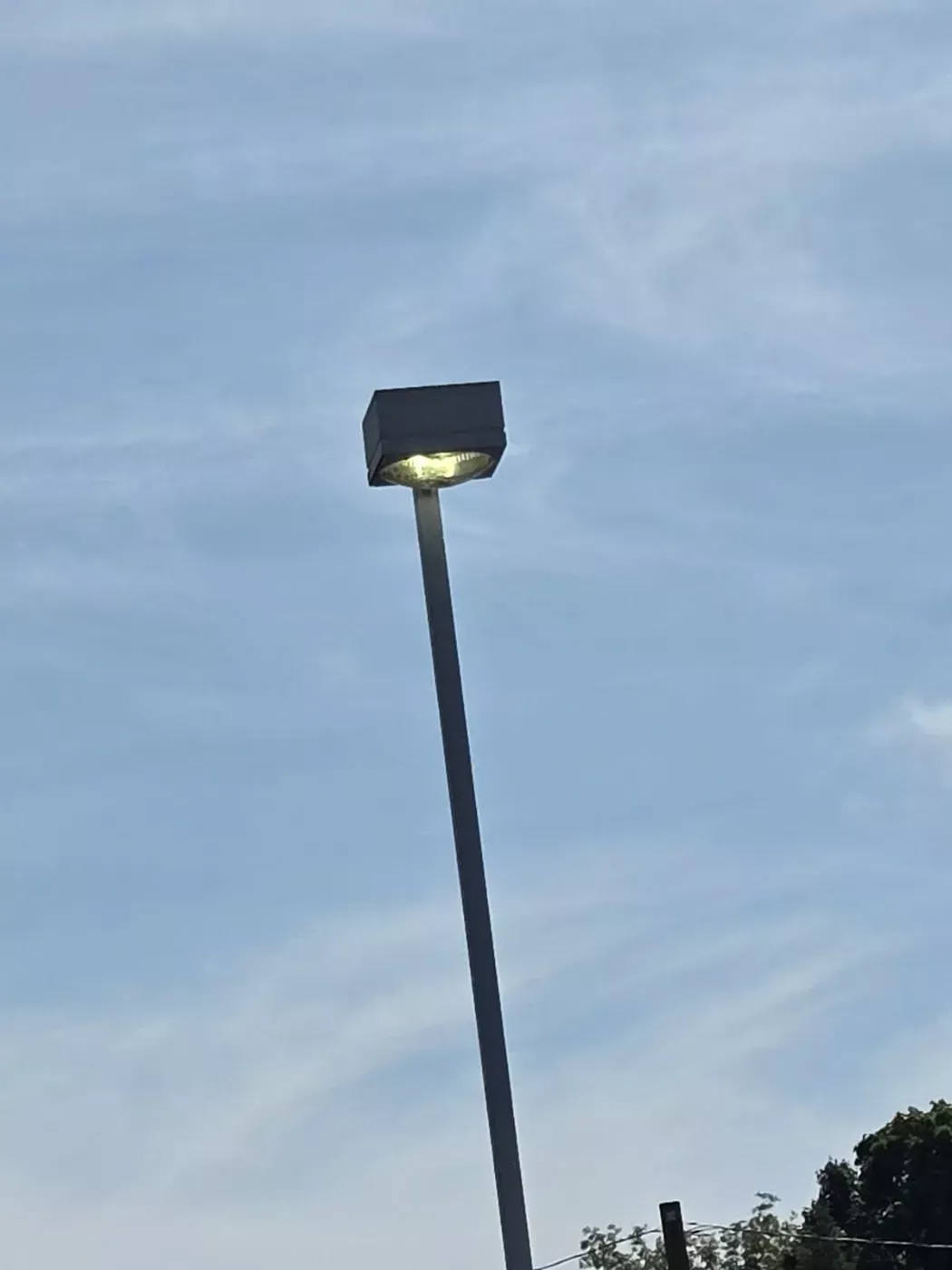 Parking lot light pole lit after repair